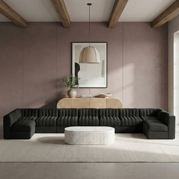 Charcoal armless velvet modular sectional with tufted back cushions and wide chaise-like seats