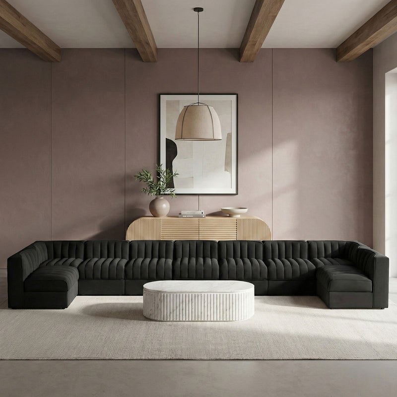 Charcoal armless velvet modular sectional with tufted back cushions and wide chaise-like seats