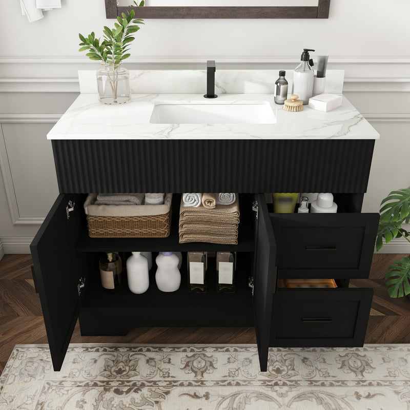 Black ribbed vanity with marble-look top, open cabinet storage, and single-hole sink