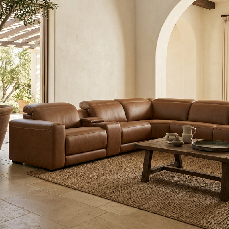 Caramel leather power reclining sectional with padded armrests and multiple reclining seats