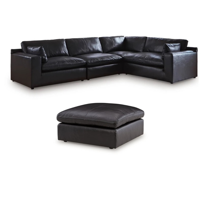 Black top-grain leather corner sectional sofa with tufted arm and ottoman