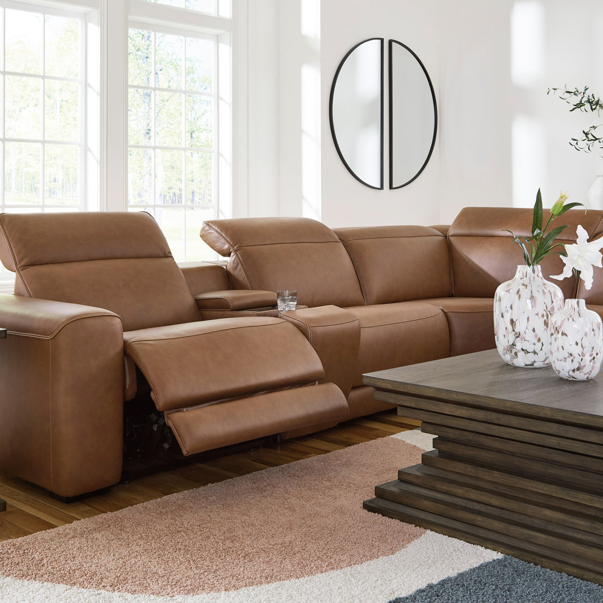 Caramel leather power reclining sectional with wide seating and multiple recliner headrests