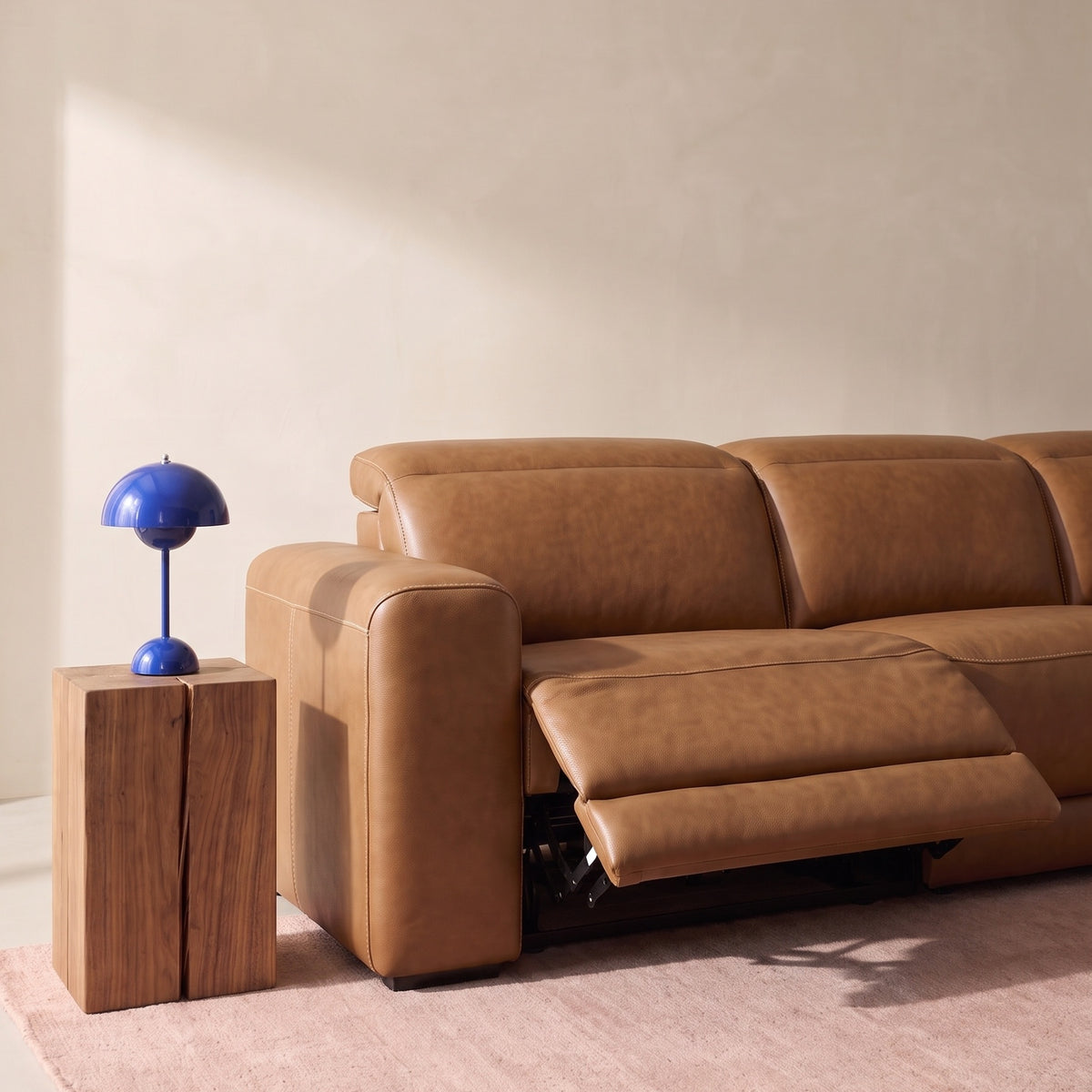Caramel leather power reclining sectional with reclining chaise and padded footrest