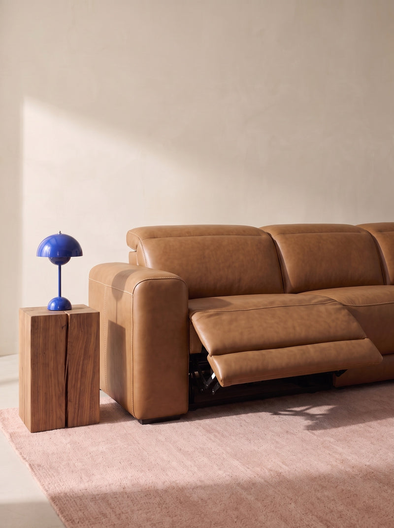 Caramel leather power reclining sectional with reclining chaise and padded footrest