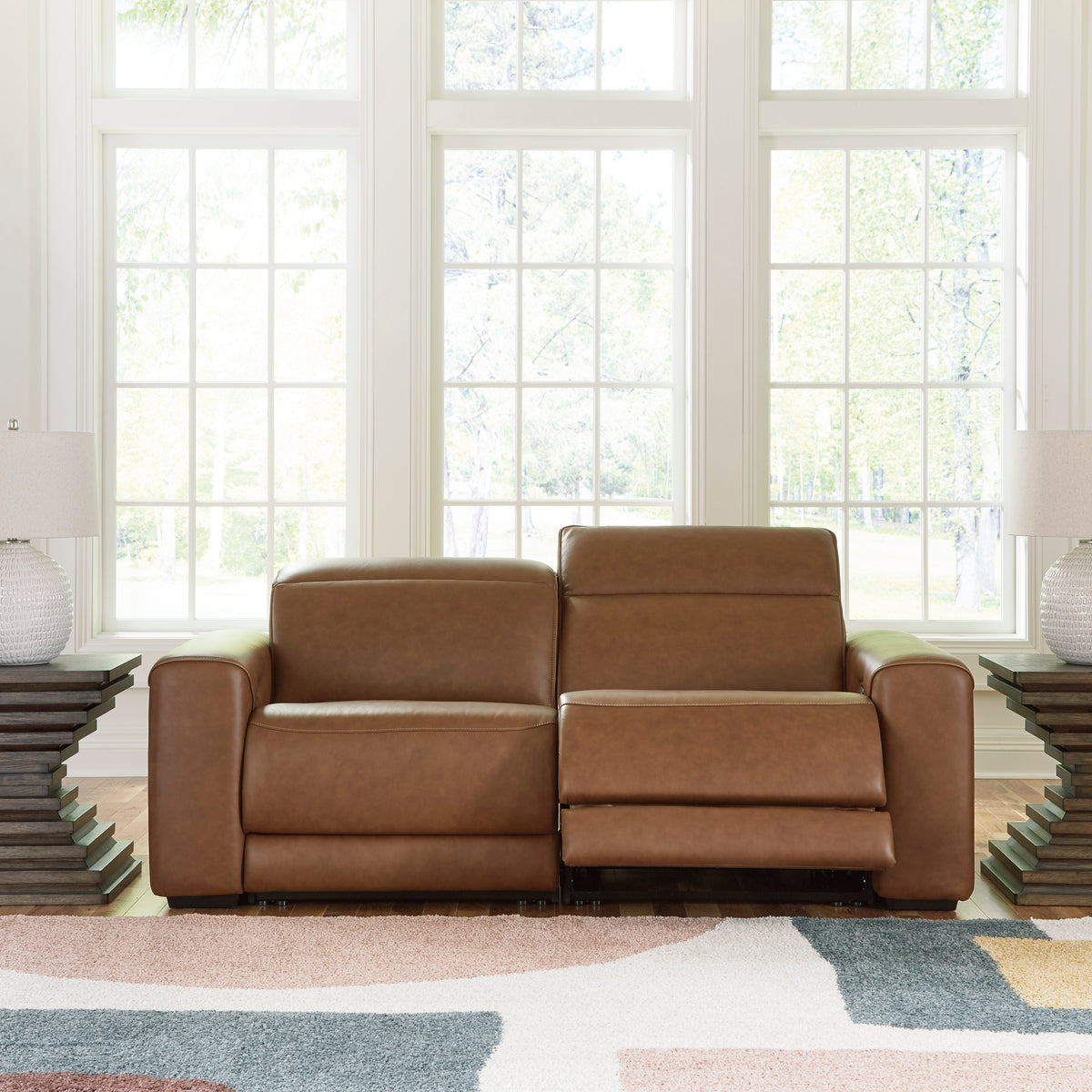 Caramel leather power reclining sectional with two reclining seats and wide armrests
