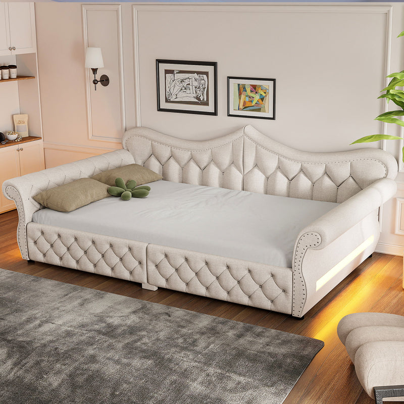 Beige upholstered daybed with tufted panels and side LED strip, nailhead trim
