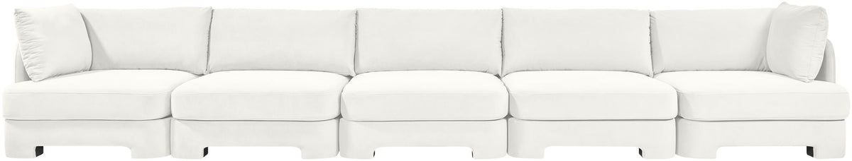White velvet upholstered sectional sofa with modular seats and back cushions
