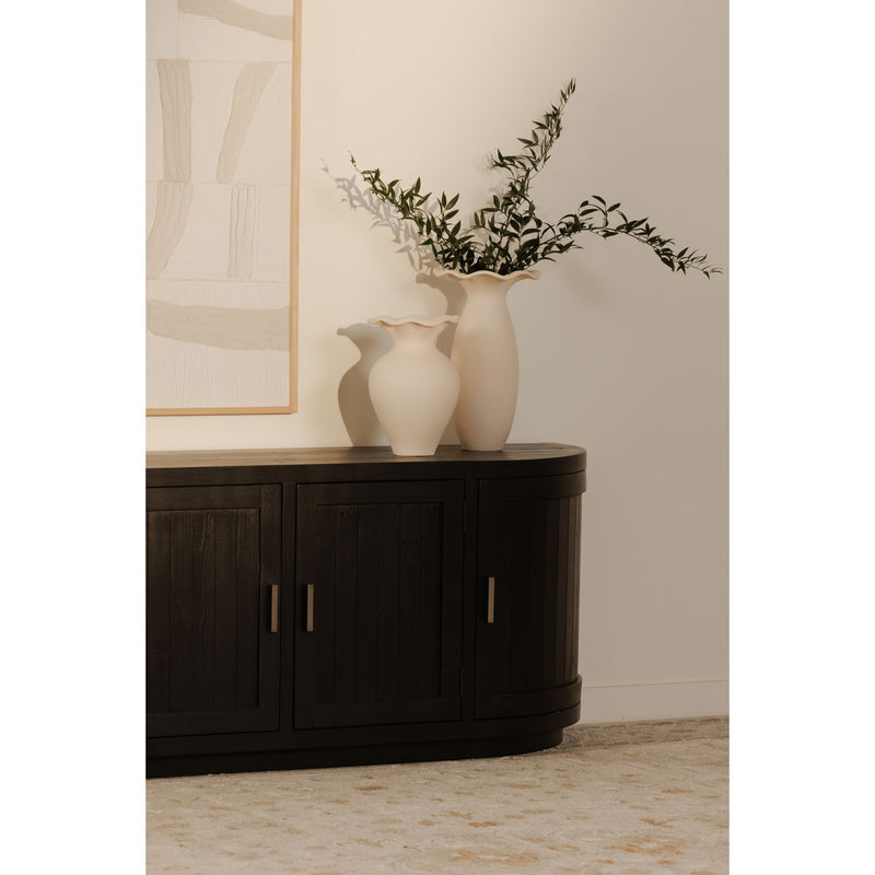 Black curved media cabinet with paneled doors and vertical gold-tone handles
