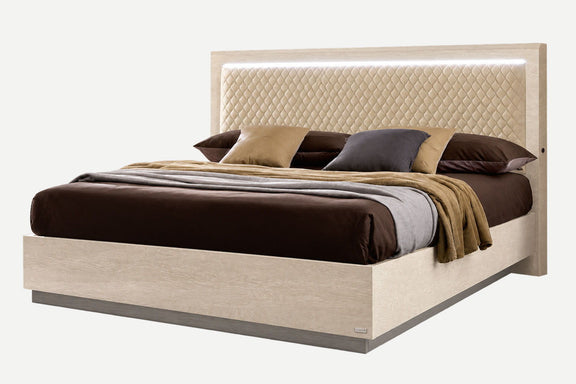 Queen upholstered bed with tufted headboard, light beige frame, assorted throw pillows