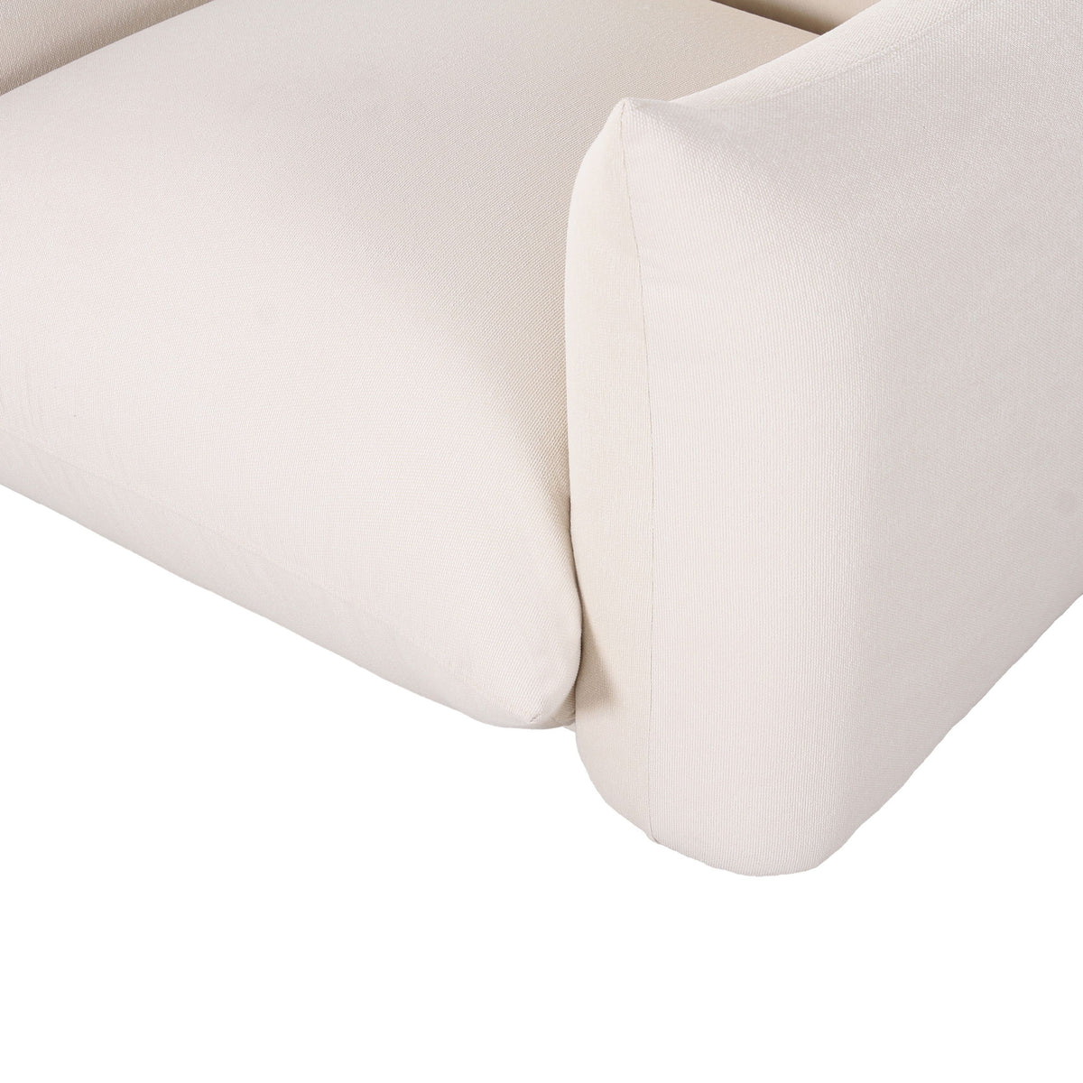White outdoor armchair close-up of curved armrest and side cushion with upholstered seam