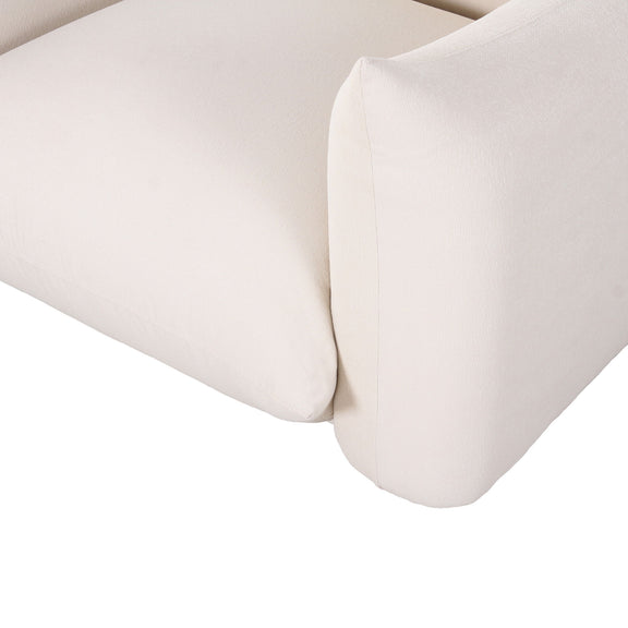 White outdoor armchair close-up of curved armrest and side cushion with upholstered seam