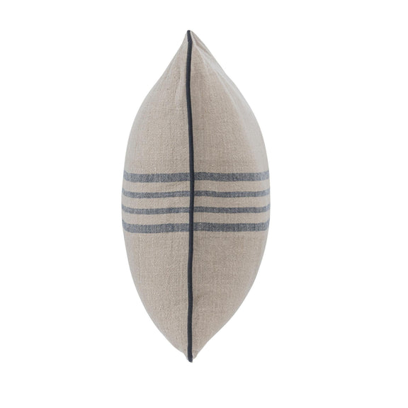 Natural linen decorative pillow with blue stripe band and dark piped edge, side view.