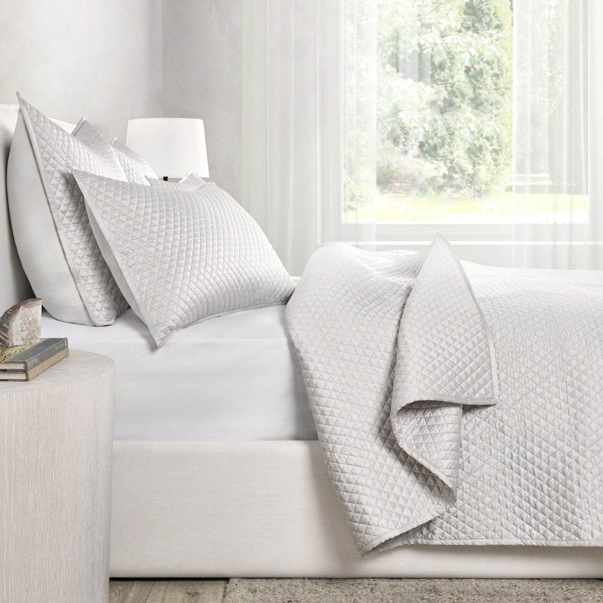 Quilted rectangular sham pillows in light gray, diamond pattern texture