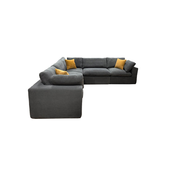 Gray sectional sofa with chaise corner and two yellow throw pillows