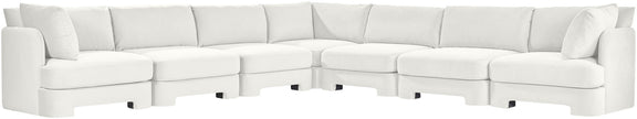 White velvet corner sectional sofa with tufted cushions and low profile arms