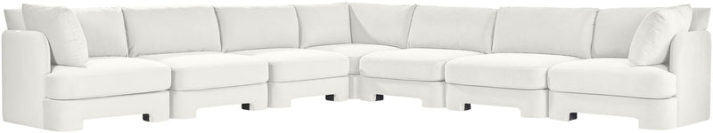 White velvet corner sectional sofa with tufted cushions and low profile arms