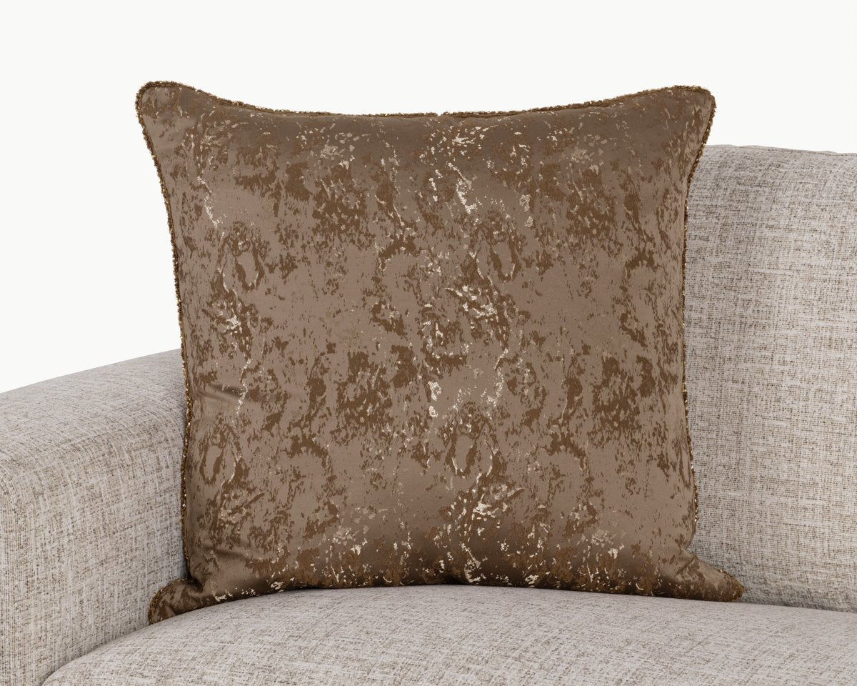 Textured throw pillow with mottled dark bronze pattern and piped edges, front view