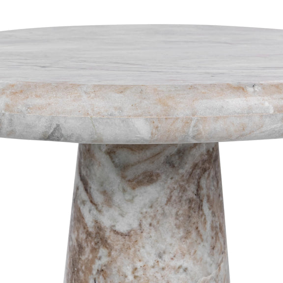 Gray marble tabletop edge above veined pedestal base