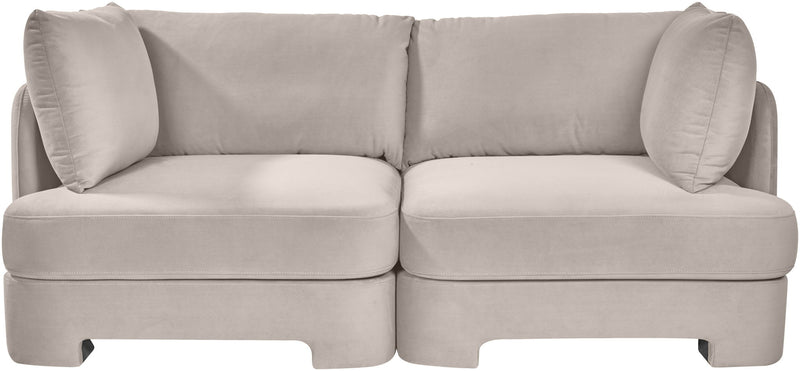 Pale gray velvet upholstered loveseat with rounded arms and two back cushions