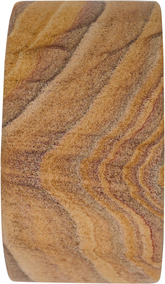 Sandstone bookend close-up, wavy layered stripes in tan, brown, and gray