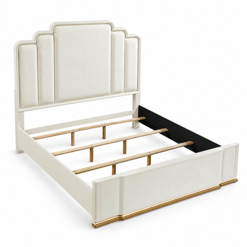Beige upholstered bed frame with curved headboard and side rails, gold-finish trim