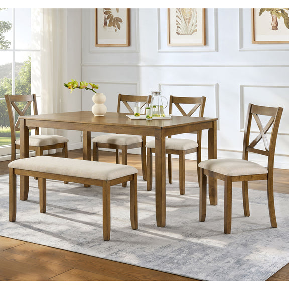 Dining table set with upholstered bench and four cross-back chairs around rectangular table.
