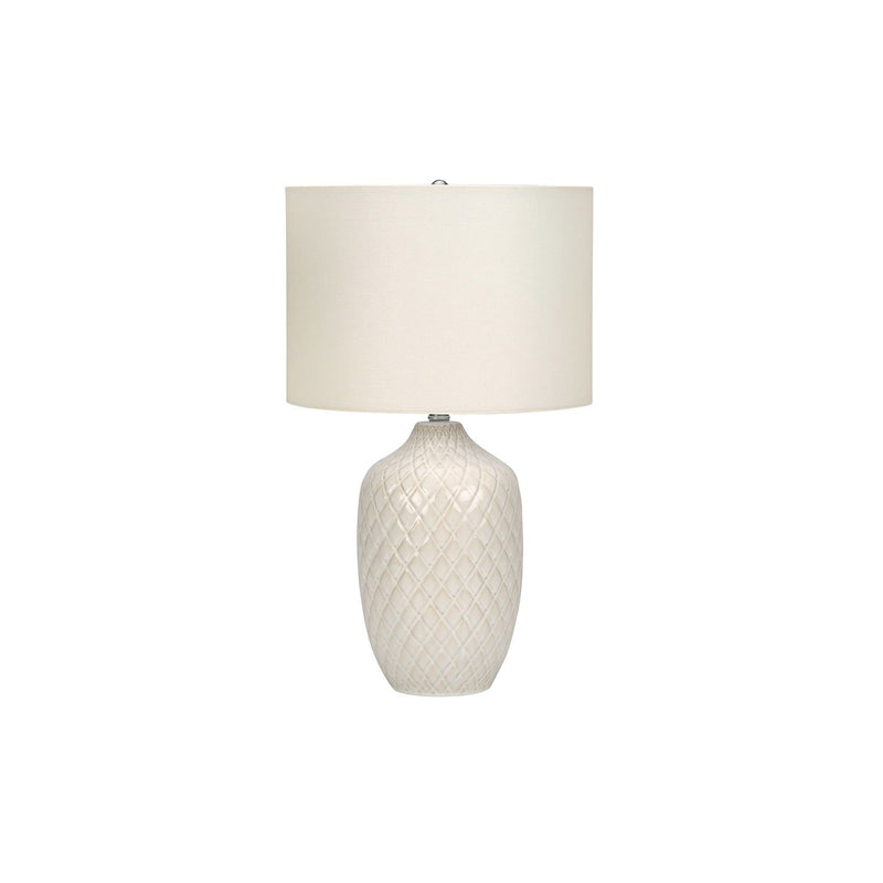 Cream table lamp with drum shade and textured ceramic diamond-pattern base