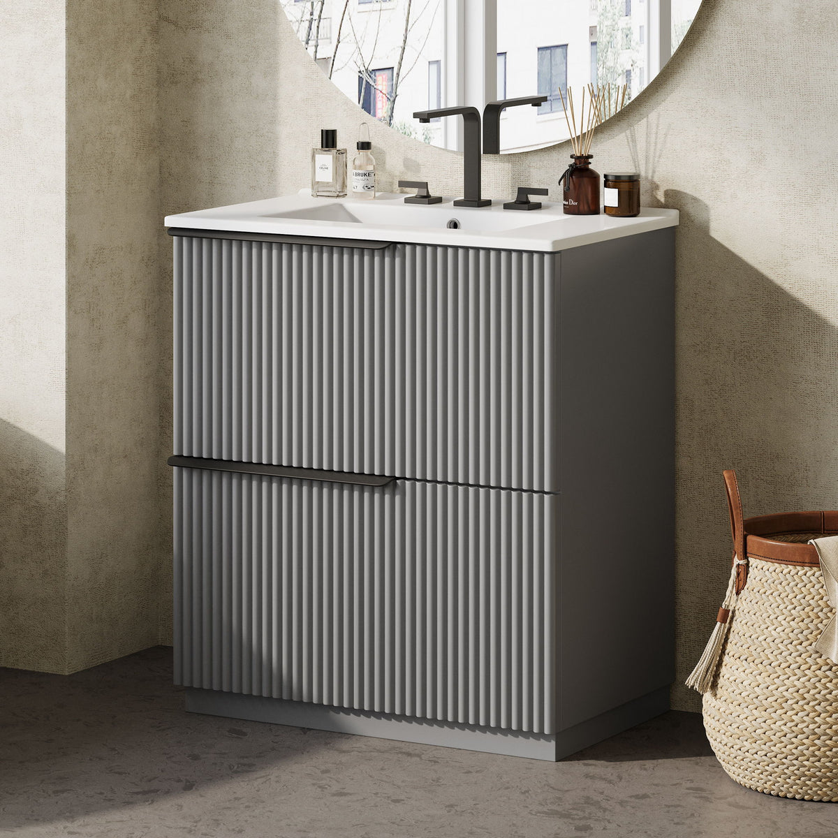 Dark gray fluted freestanding bathroom vanity with ceramic sink and bar handle