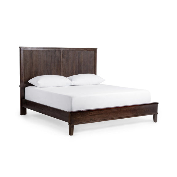 Brown solid wood bed with tall slatted headboard and white bedding