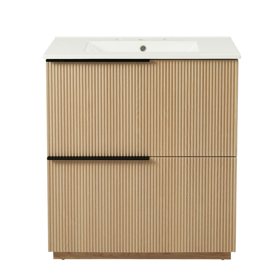Light brown fluted bathroom vanity with white ceramic sink and center handle bar