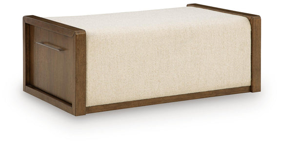 Brown upholstered storage ottoman with hinged lift-top and beige fabric cushion