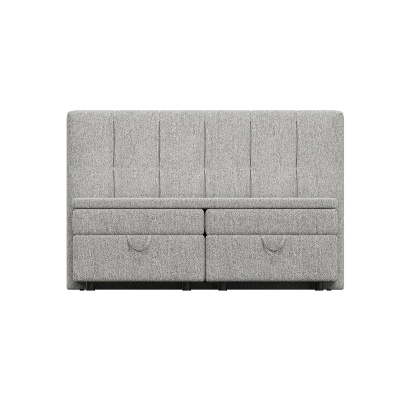 Light gray upholstered bed with split-front storage drawers and tall tufted headboard