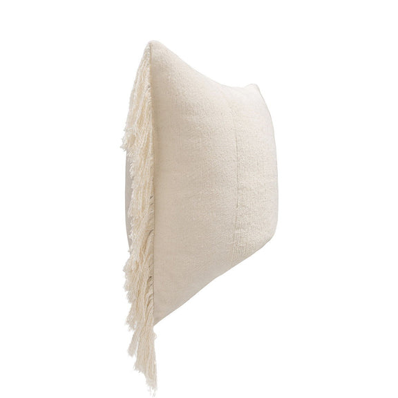 Ivory square pillow with woven texture and long fringe tassels along edges