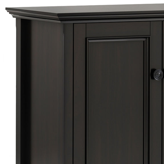 Close-up of the cabinet's dark brown finish, raised door panel, and round knob