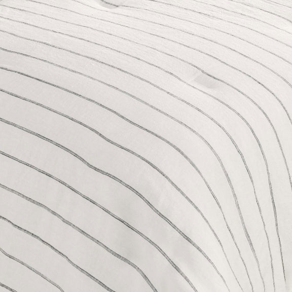 Ivory comforter fabric with thin vertical pinstripes