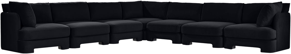 Black velvet corner sectional sofa with tufted cushions and low profile arms