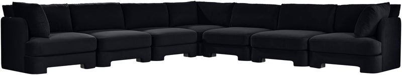 Black velvet corner sectional sofa with tufted cushions and low profile arms