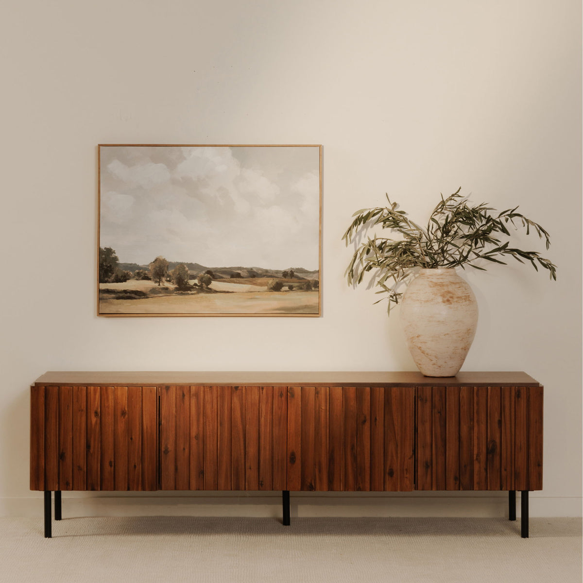 Low-profile brown media cabinet with vertical wood slat doors and black tapered legs