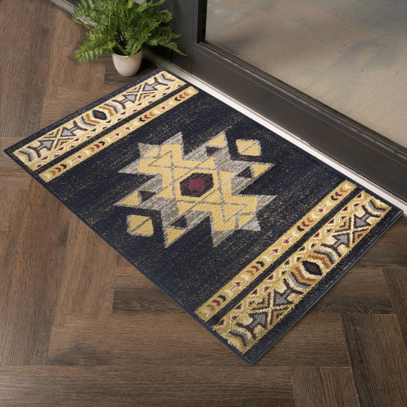 Black southwest area rug with central star motifs, yellow accents, and patterned border