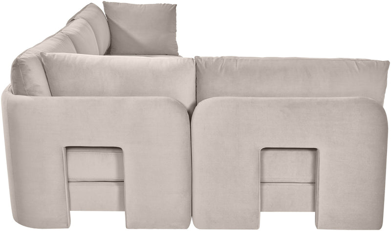 Light gray velvet armless sectional sofa, close-up of rounded arm panels