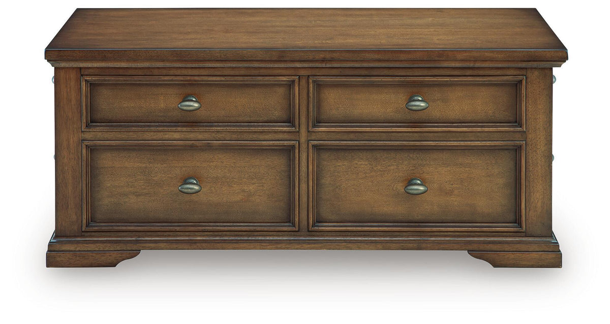 Dark brown wood coffee table front with four drawers and metal cup pulls, flat top
