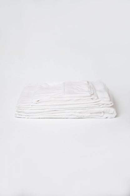 White brushed split sheet set, neatly folded stack of sheets