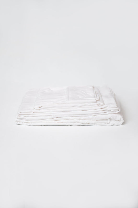 White brushed split sheet set, neatly folded stack of sheets