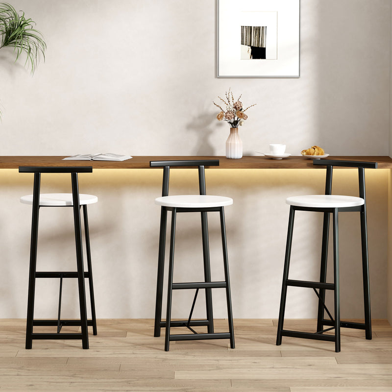 Set of 3 bar stools with backs, white round seats, black metal legs, footrests