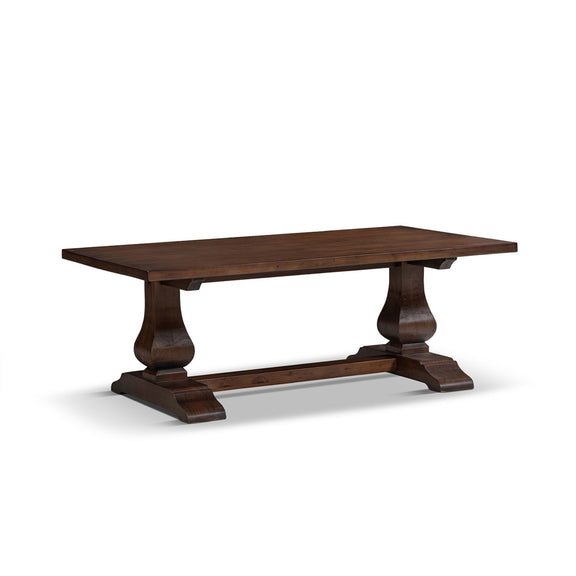 Brown wooden coffee table with pedestal base and four curved legs