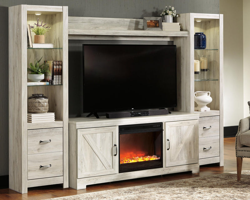 Light beige entertainment center with TV mount and lower electric fireplace insert