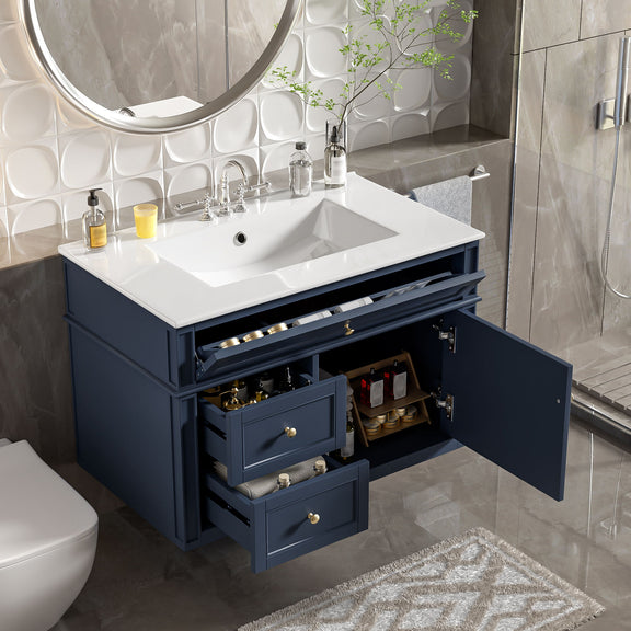 Blue vanity with white sink and open drawers and cabinet door showing storage.