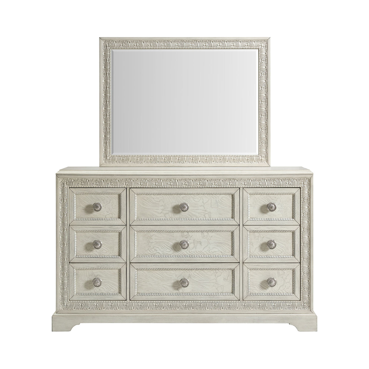 White dresser with mirror featuring three rows of drawers and round silver knobs.