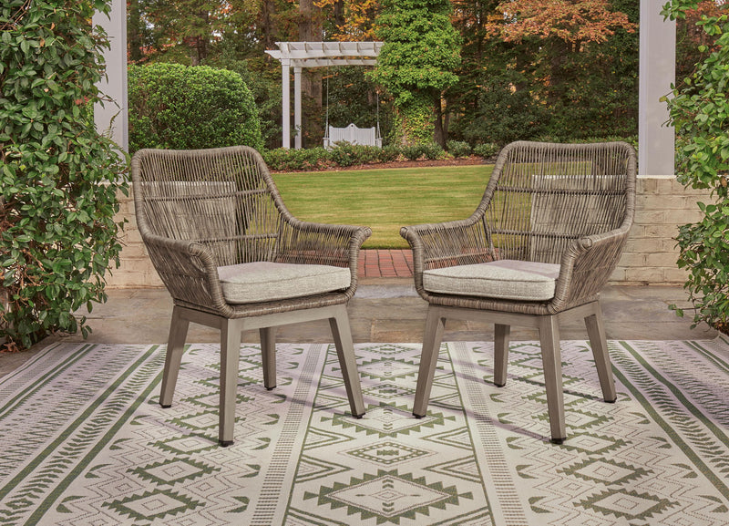 Set of 2 beige woven armchairs with light gray cushions, side-by-side arrangement