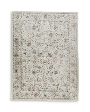 Beige rug with ornate distressed floral medallion pattern and border
